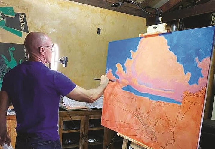 Cody DeLong painting in studio (Courtesy/ Mountain Trails Gallery)