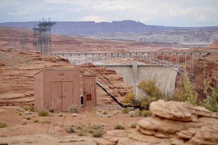 A pipe carries water from the Colorado River into a shed in Page. Infrastructure like this is common in smaller, more rural communities, which can be less likely to take advantage of federal spending. (Photo by Alex Hager/KUNC)