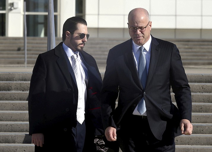Samuel Miele, left, leaves Federal Court in Central Islip, N.Y., with his lawyer, Kevin Marino, on Tuesday, Nov 14, 2023. Miele, a former fundraiser for U.S. Rep. George Santos, pleaded guilty to a federal wire fraud charge. (John Roca/Newsday via AP)