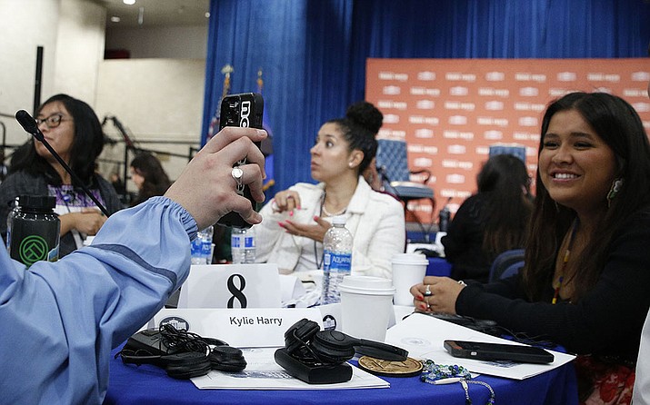 Gabriella Nakai, far right, smiles for a photo at a table with other teens at the White House Tribal Youth Forum in Washington. Nakai was one of two Center for Native American Youth “Champions for Change” from Arizona who were at the forum. (Photo/Lux Butler, Cronkite News)