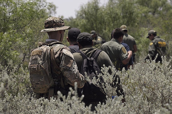Use-of-force reports have surged in recent years, along with border encounters. Customs and Border Protection says it is committed to investigating such incidents, but advocates are unimpressed. Here, Border Patrol agents detain four migrants stopped near the Texas border in a 2019 photo. (Photo by Glenn Fawcett/Customs and Border Protection)