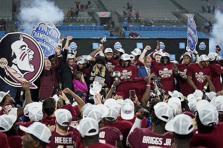 Florida State celebrates after defeating Louisville in the Atlantic Coast Conference championship NCAA college football game Saturday, Dec. 2, 2023, in Charlotte, N.C. (Erik Verduzco/AP)