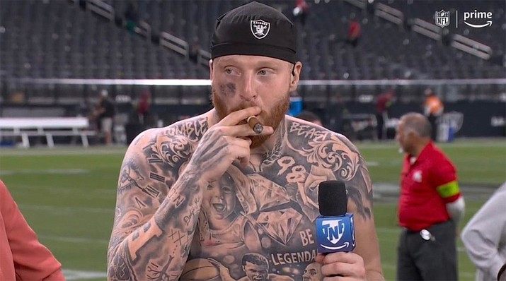 Maxx Crosby smoking a backwood during a post-game interview after the , Maxx Crosby