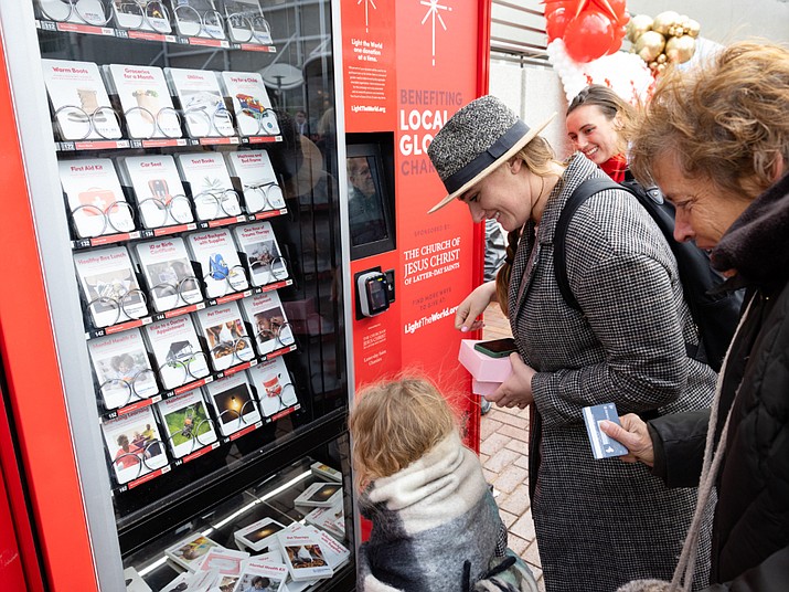 People purchase items from a Giving Machine. (Photo/Giving Machines)