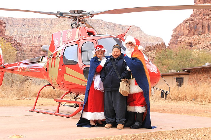Santa and Mrs. Claus visit with Dalla Wescogame at Supai Village during the Marine League Charities, Toys for Tots fly-in Dec. 20. This was the first time the event had taken place in person since 2019 after the closure of the village because of the coronavirus pandemic. (Loretta James/WGCN)