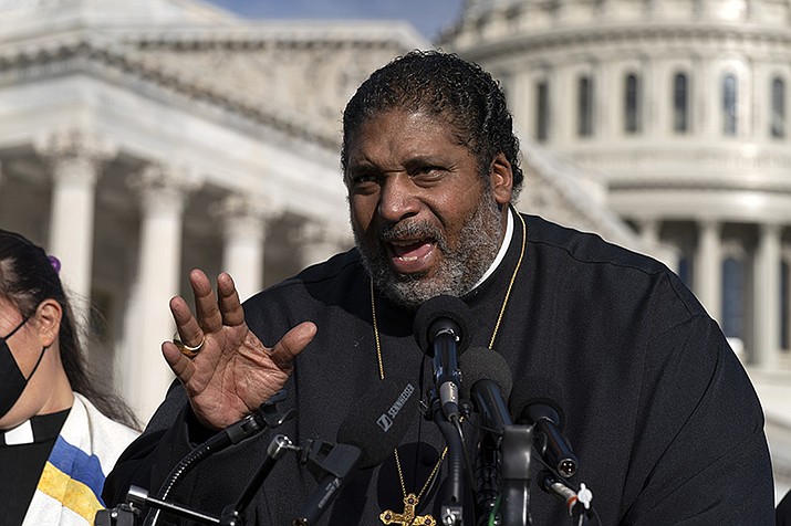 The Rev. William Barber was escorted by police out of a North Carolina movie theater, Tuesday, Dec. 26, 2023, after he insisted on using his own chair for medical reasons, prompting an apology from the nation's largest movie theater chain. (Jose Luis Magana/AP Photo, File)