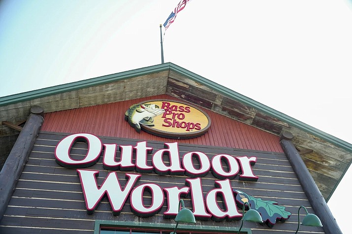 In this Sept. 19, 2017 file photo, the Bass Pro Shops logo is seen at the entrance to a store in Council Bluffs, Iowa. Police in Alabama say a man crashed his car outside a Bass Pro Shop, Thursday night, Jan. 4, 2024, and stripped down to his birthday suit and then plunged into the giant aquarium inside the store. "Nati Harnik/AP-File)