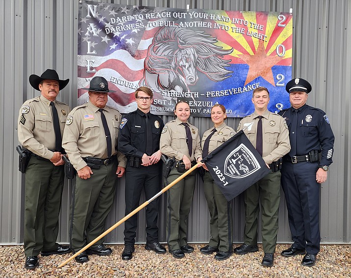 Sgt. Jay Valenzuela, left, Deputy Vince Palazzolo, Round Valley Police Department’s recruit Thomas Scruggs, Navajo County Sheriff’s Office recruits Ashley Watson, Desiree Rodriguez, Justin Hart, and Officer Les Shumway were sworn in Dec. 15. (Photo/Navajo County)