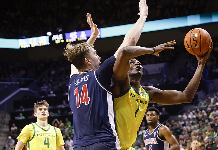 Oregon center N'Faly Dante (1), shoots against Arizona center Motiejus Krivas (14) during the first half of an NCAA college basketball game in Eugene, Ore., Saturday, Jan. 27, 2024. (Thomas Boyd/AP)