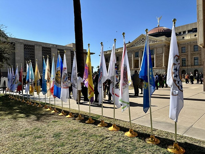 The flags of Arizona’s 22 Tribal Nations are displayed in front of the capitol in celebration of Indian Nations and Tribes Legislative Day on Jan. 10. (Shondiin Silversmith/ AZ Mirror)
