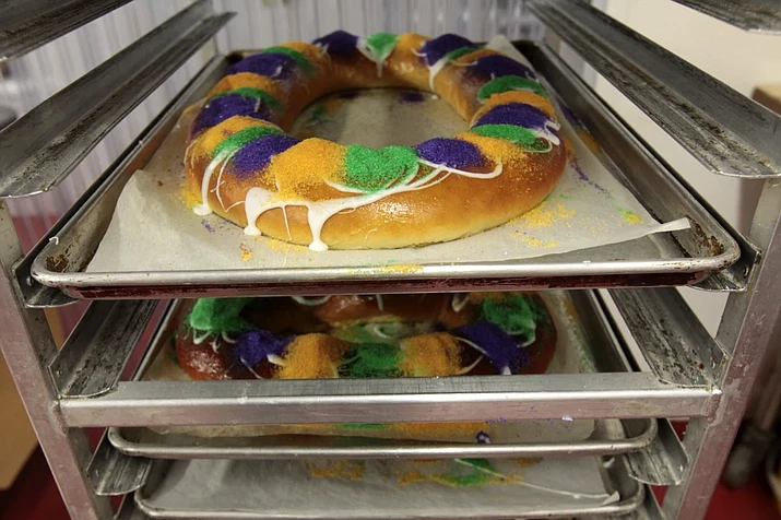 Mardi Gras King Cakes by pastry chef Jean-Luc Albin at Maurice French Pastries are displayed on Feb. 10, 2011, in Metairie, LA. A theft stole seven king cakes – about as many as he could carry – during a break-in last week at a New Orleans bakery. The thief also took cash and a case of vodka from Bittersweet Confections last Wednesday, Jan. 24, 2024 according to New Orleans Police Department. (Gerald Herbert/AP-File)