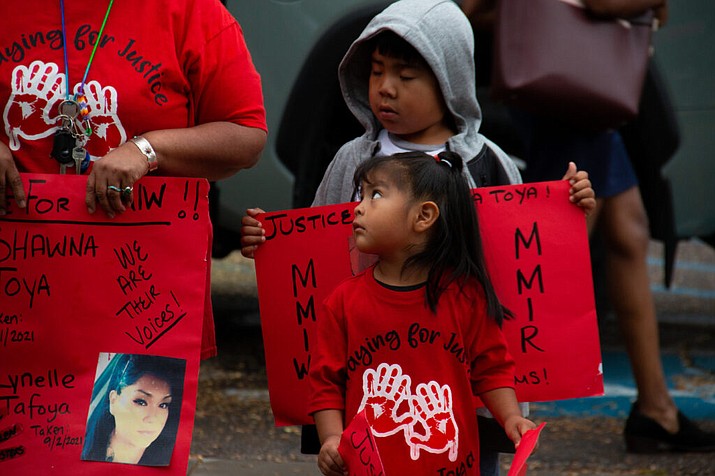 Geraldine Toya’s grandchildren look up at her as she speaks about the death of their mother Shawna Toya at a MMIWR demonstration in 2022. (Photo/ Shelby Wyatt,Source NM)