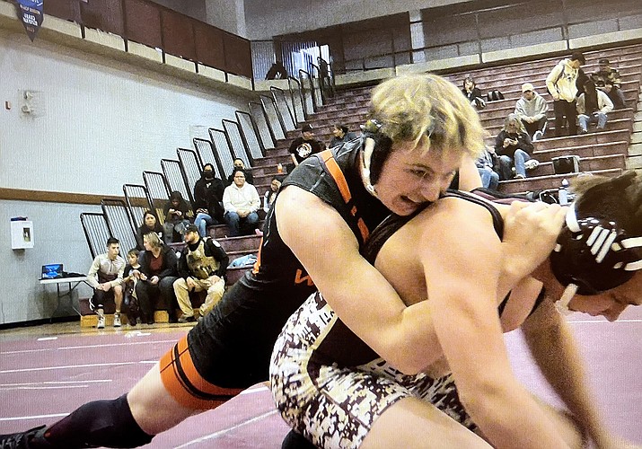 Brandon Rico in action during his wrestling match. Bottom: Hope Inman wrestles to pin her opponent. (Submitted photo)
