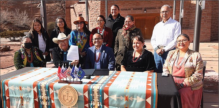 Members of the 25th Navajo Nation Council and Speaker Crystalyne Curley gathered with Navajo Nation President Dr. Buu Nygren as he signed Resolution CJA-11-24 in front of the Navajo Nation Council Chamber. (Photo/Office of Speaker)
