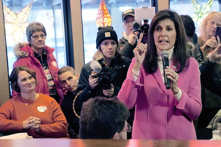 Republican presidential hopeful Nikki Haley speaks with supporters Jan. 15, 2024, in Des Moines, Iowa. Even without Donald Trump on Nevada’s Republican ballot, Nikki Haley was still denied her first victory. The indignity of a distant second-place finish behind “none of these candidates” was a blow for Haley facilitated by the staunch Trump allies who lead Nevada’s GOP. They had already maneuvered to ensure Trump has a lock on the state’s 26 delegates, who will be awarded in caucuses on Thursday where he faces only token opposition. (Meg Kinnard/AP-File)