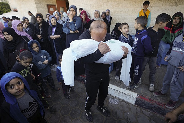 A Palestinian morns a relative killed in the Israeli bombing of the Gaza Strip in Deir al Balah, Gaza Strip, on Sunday, Feb. 11, 2024. (Adel Hana/AP)