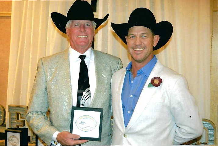 Steve Schmidt, left, receives the prestigious Danny Freeman Award from Prescott Frontier Days General Manager Jim Dewey Brown. (Courtesy photo)
