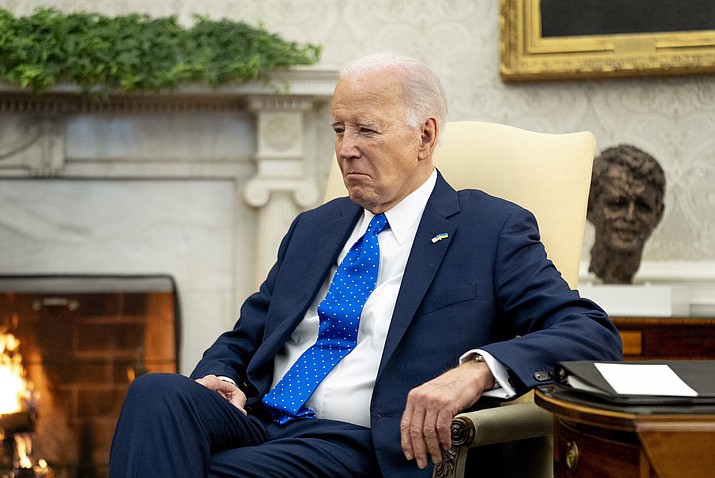 President Joe Biden sits in the Oval Office of the White House, Friday, Feb. 9, 2024, in Washington. Biden's team hopes it has found an unlikely opportunity to go on offense, and perhaps to unite an anxious Democratic Party, following the release of a special prosecutor's report on Thursday, Feb. 8, that cleared Biden of criminal charges, despite finding evidence that the president willfully retained and shared highly classified information as a private citizen. The counsel made repeated negative references to the 81-year-old president's age and memory that echo broader concerns raised by voters in both parties. (Andrew Harnik/AP-File)