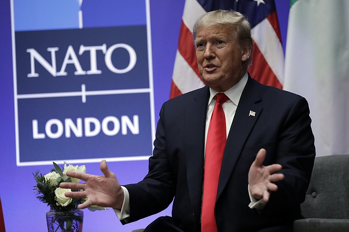 President Donald Trump meets with Italian Prime Minister Giuseppe Conte during the NATO summit at The Grove, Wednesday, Dec. 4, 2019, in Watford, England. Former US president Donald Trump says he once warned that he would allow Russia to do whatever it wants to NATO member nations that are “delinquent” in devoting 2% of their gross domestic product to defense. Trump’s comment on Saturday represented the latest instance in which the former president and Republican front-runner seemed to side with an authoritarian state over America’s democratic allies. (Evan Vucci/AP-File)