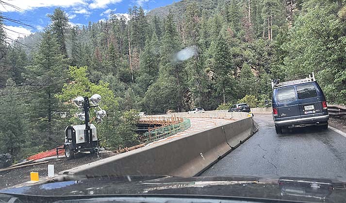 Cars pass over the bridge at Pumphouse Wash Bridge in Oak Creek Canyon last year during construction. The work continues this summer. (VVN/file/Vyto Starinskas)
